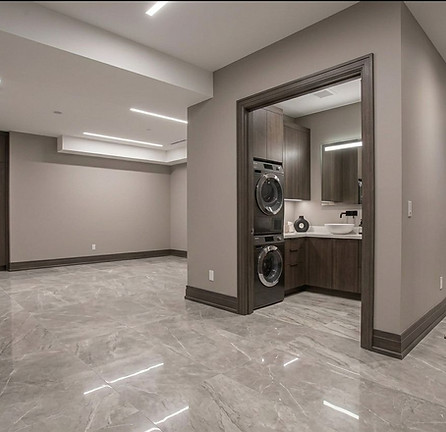 Modern basement renovations Toronto with laundry nook.