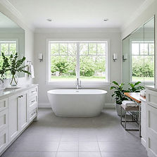 Modern bathroom renovation in Toronto featuring a freestanding tub