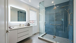 Modern bathroom renovations Toronto with blue glass shower