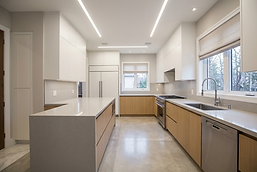 Newly renovated kitchen with white countertops in toronto.png