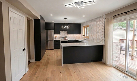 Modern kitchen renovations Toronto with black cabinets