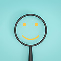 smile-only-face-inside-of-magnifier-glass_web.jpg