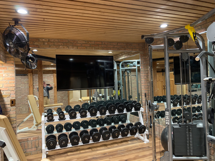 Wall mount TV in a gym mirror wall