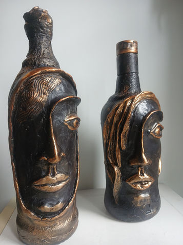 Upcycled bottles, face in a bottle