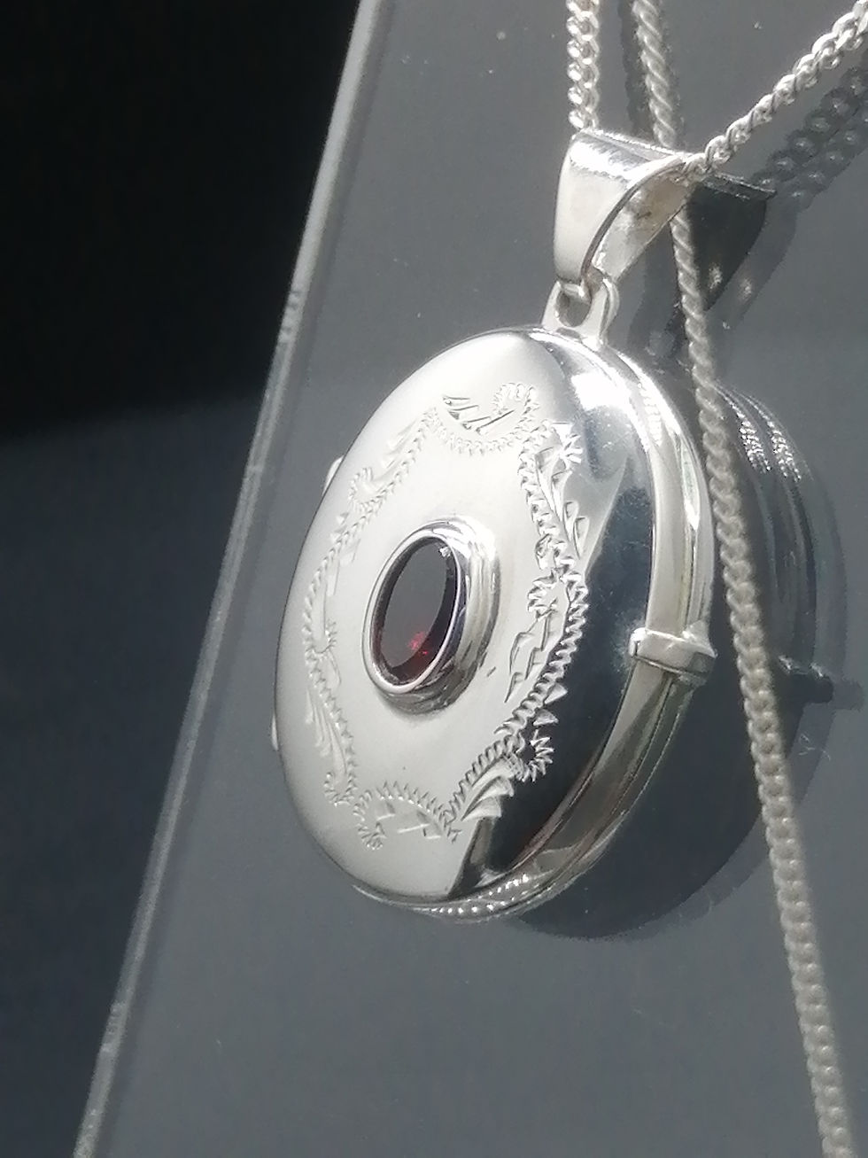 Thumbnail: 925 Silver Floral Engraved Garnet Centre Oval Locket