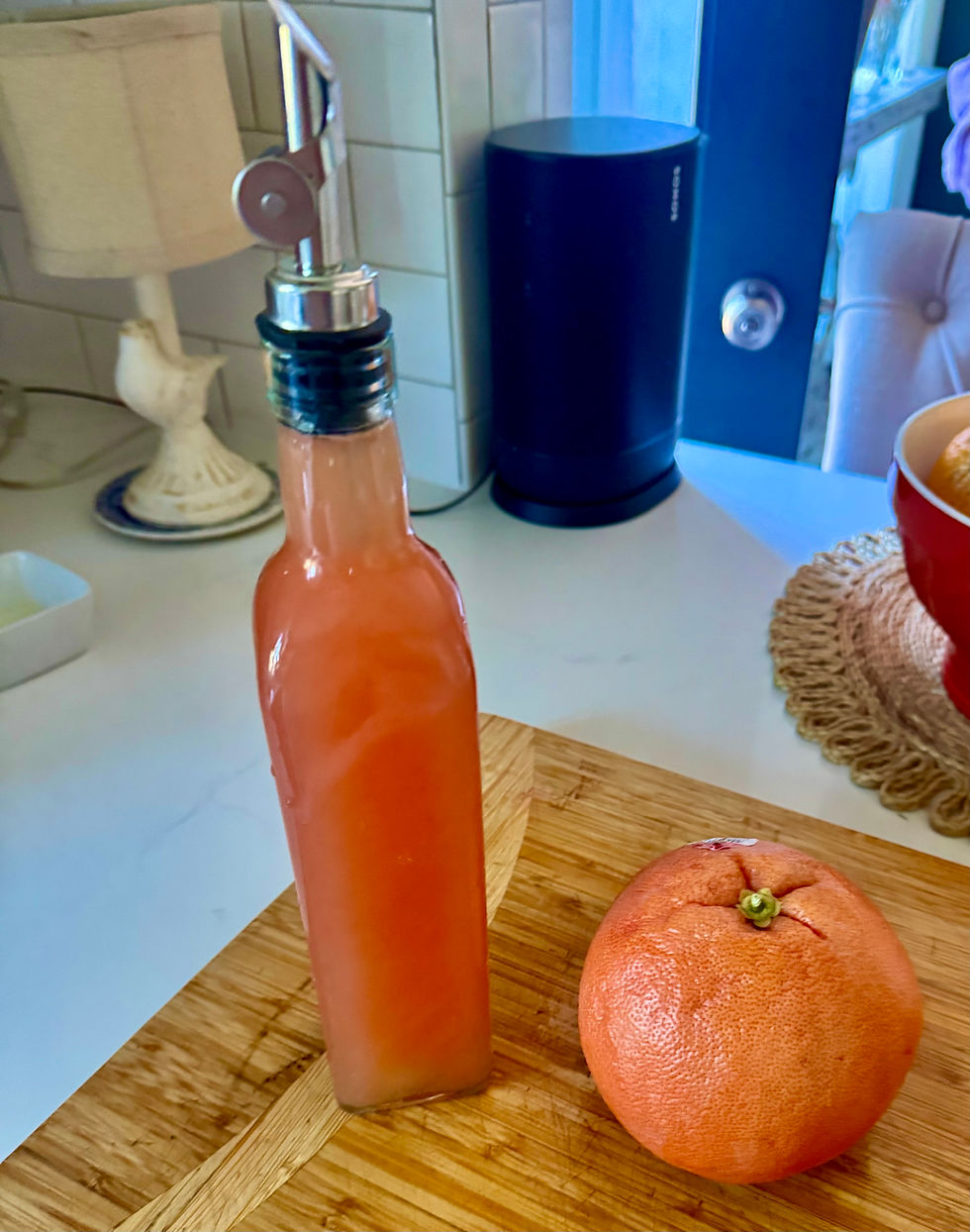 A decorative decanter of fresh grapefruit juice