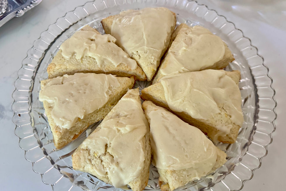 A crystal platter with orange cream scones