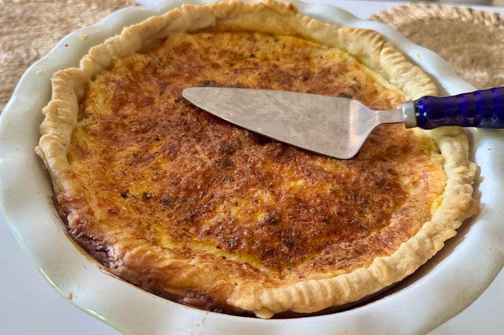 A pie plate with quiche lorraine