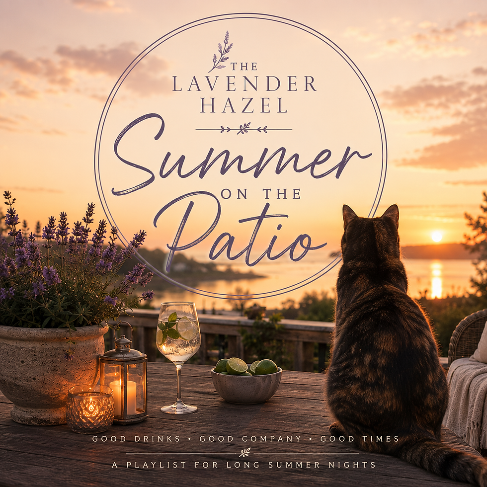 A cat on the patio table looking at the sunset with a cocktail and candles