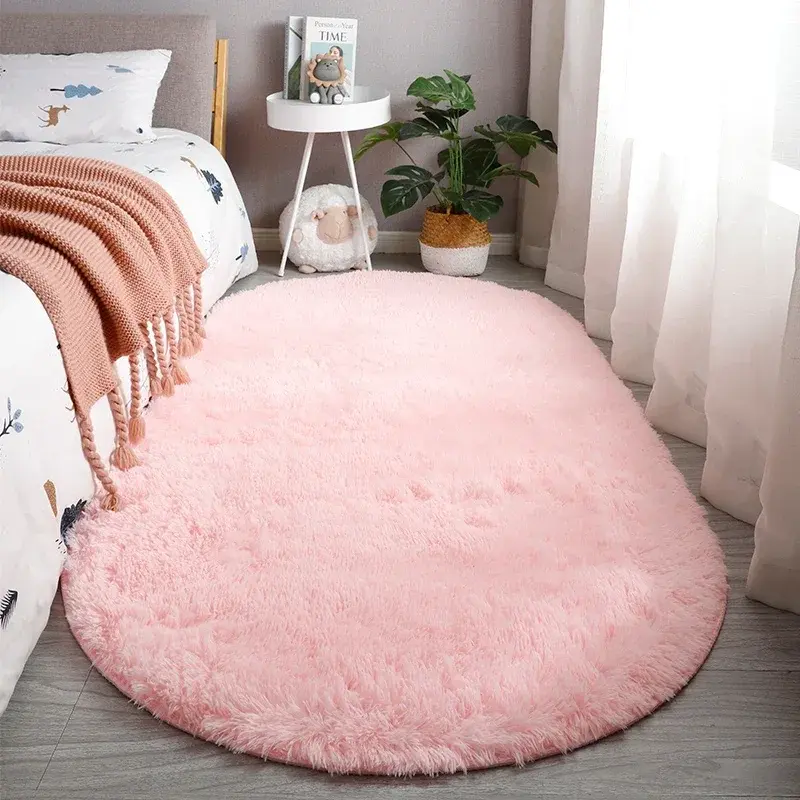 Pink oval faux fur rug