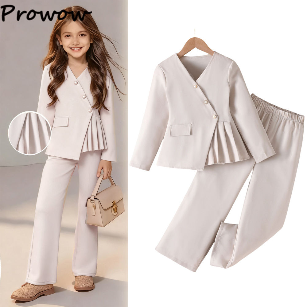 Child in beige pleated pantsuit
