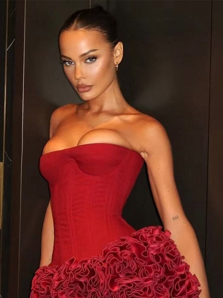 Thumbnail: Woman in red strapless corset dress