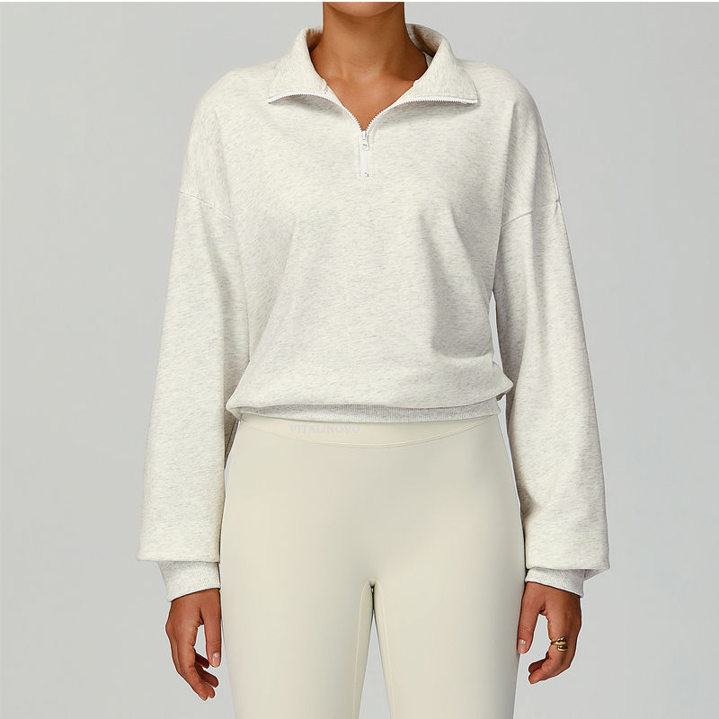 Thumbnail: Woman in cream collared sweater and matching pants