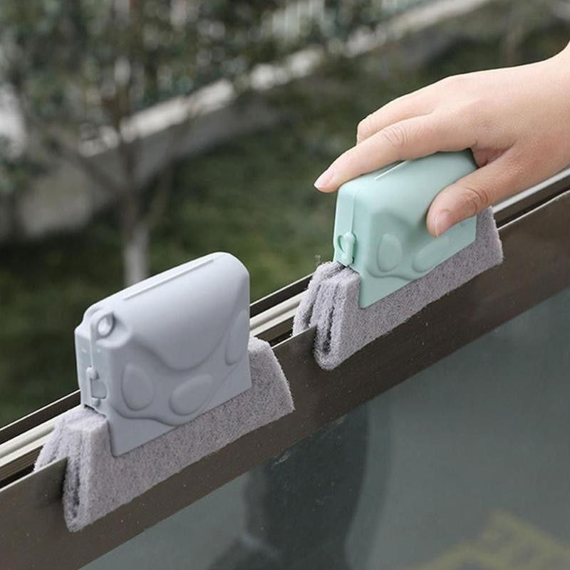 Thumbnail: Hand using a window groove cleaning brush