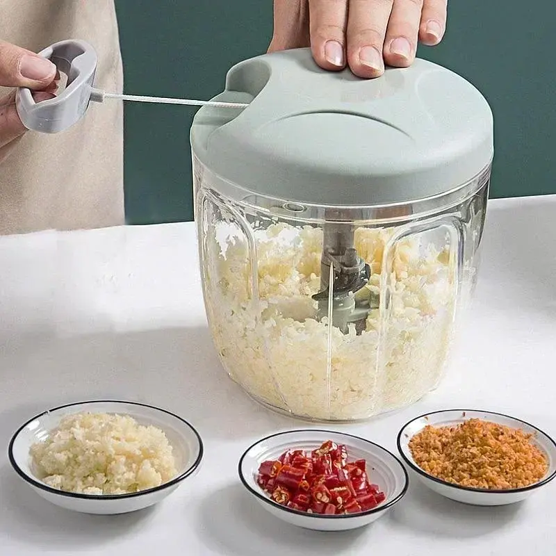 Thumbnail: Hand using manual multi-function chopper; minced garlic, chilis