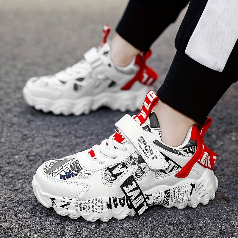 Thumbnail: White athletic sneakers with red details and graphic text