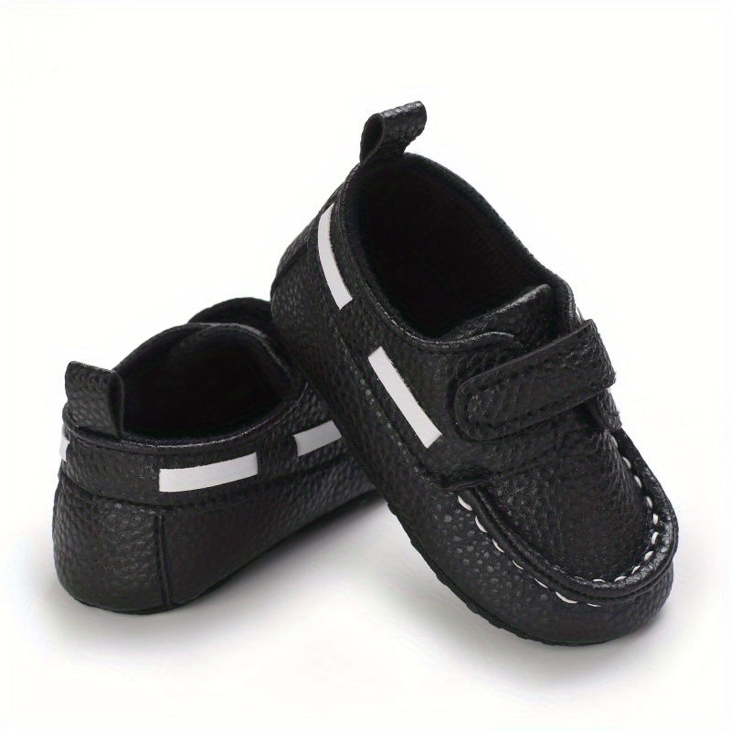 Thumbnail: Black baby slip-on sneakers with white stripe and soft sole