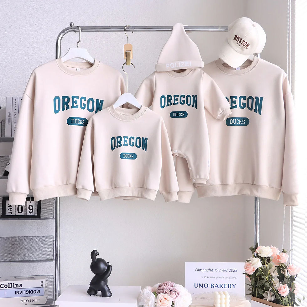 Matching family 'OREGON' sweaters, onesie, and hat