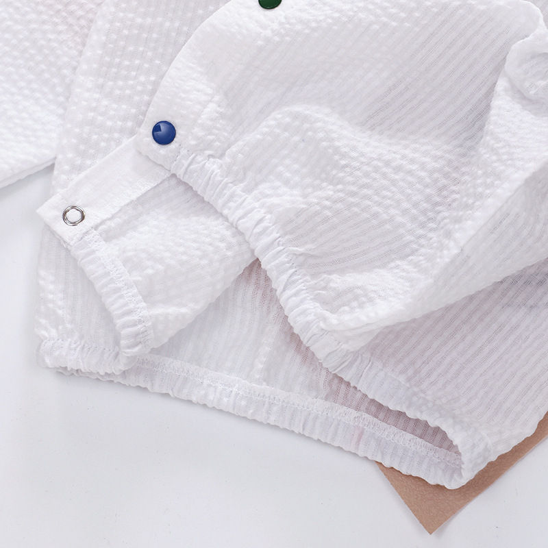 Thumbnail: White textured fabric with metal snaps