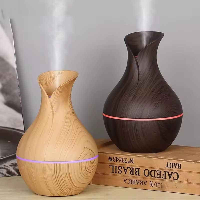 Vase-shaped wood-grain diffusers emitting mist