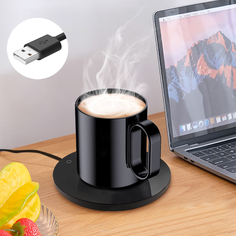 Steaming black mug on a USB-powered cup warmer