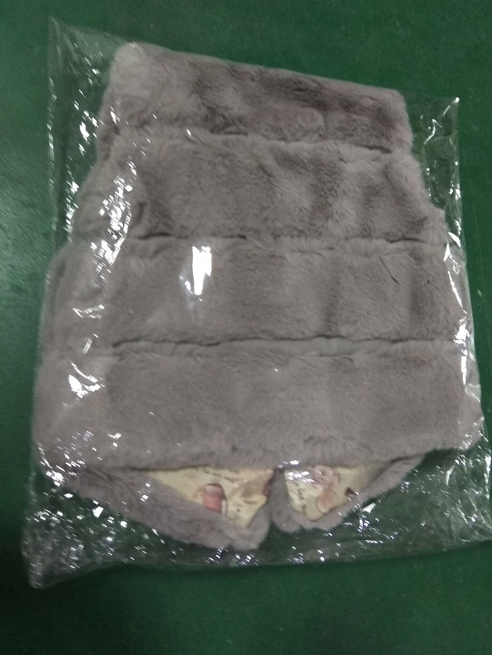 Thumbnail: Grey faux fur vest in plastic wrap