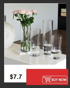 Thumbnail: Four clear glass vases, one with pink roses