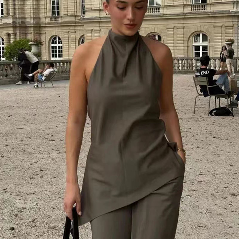 Thumbnail: Woman wearing asymmetric satin halter top and pant set