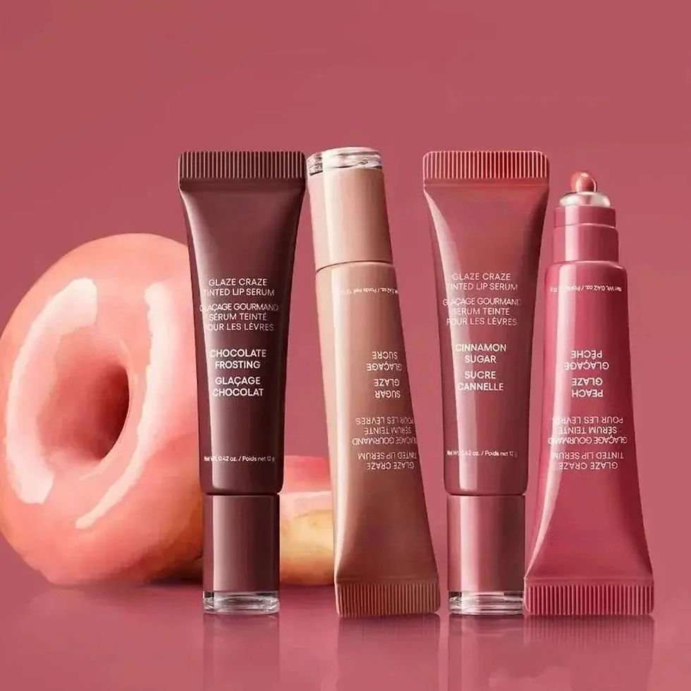 Thumbnail: Four shades of lip gloss tubes with a pink donut