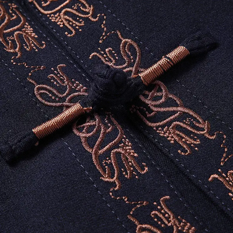 Thumbnail: Dark fabric with intricate gold embroidery and matching thread