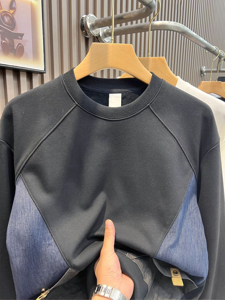 Thumbnail: Dark sweatshirt with diagonal blue denim patch