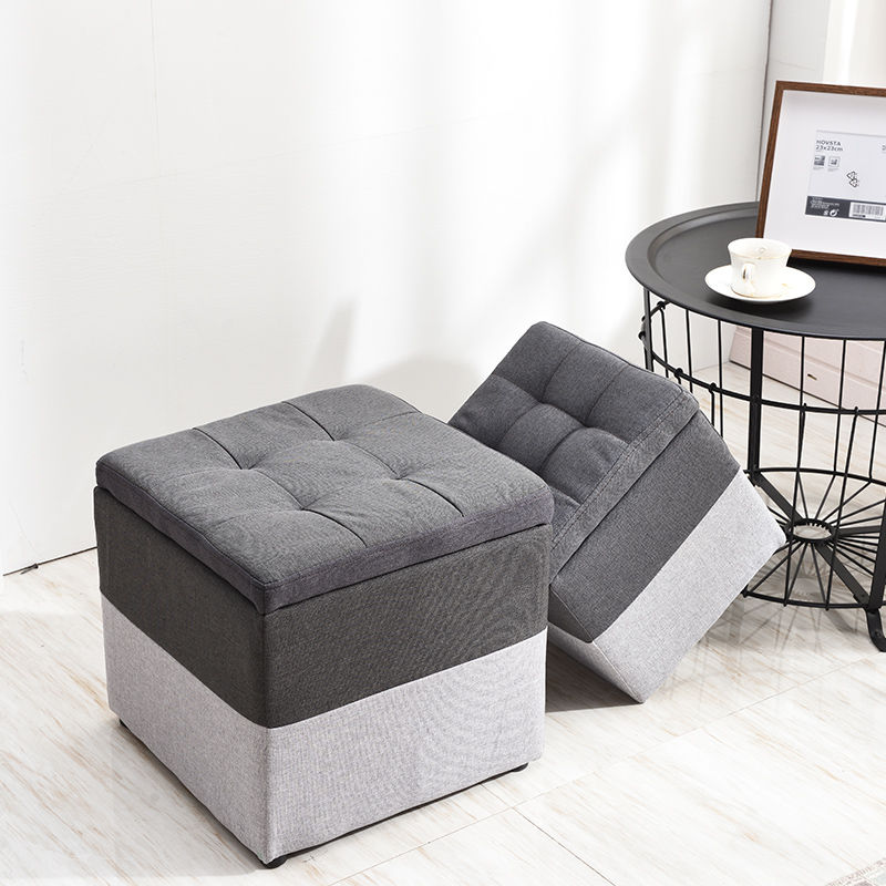 Pair of grey tufted storage ottomans