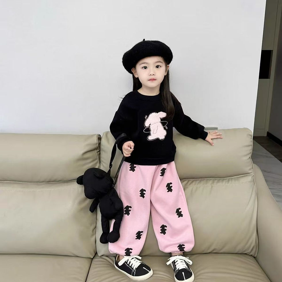 Thumbnail: Girl in black bunny sweatshirt, pink bunny pants, black beret