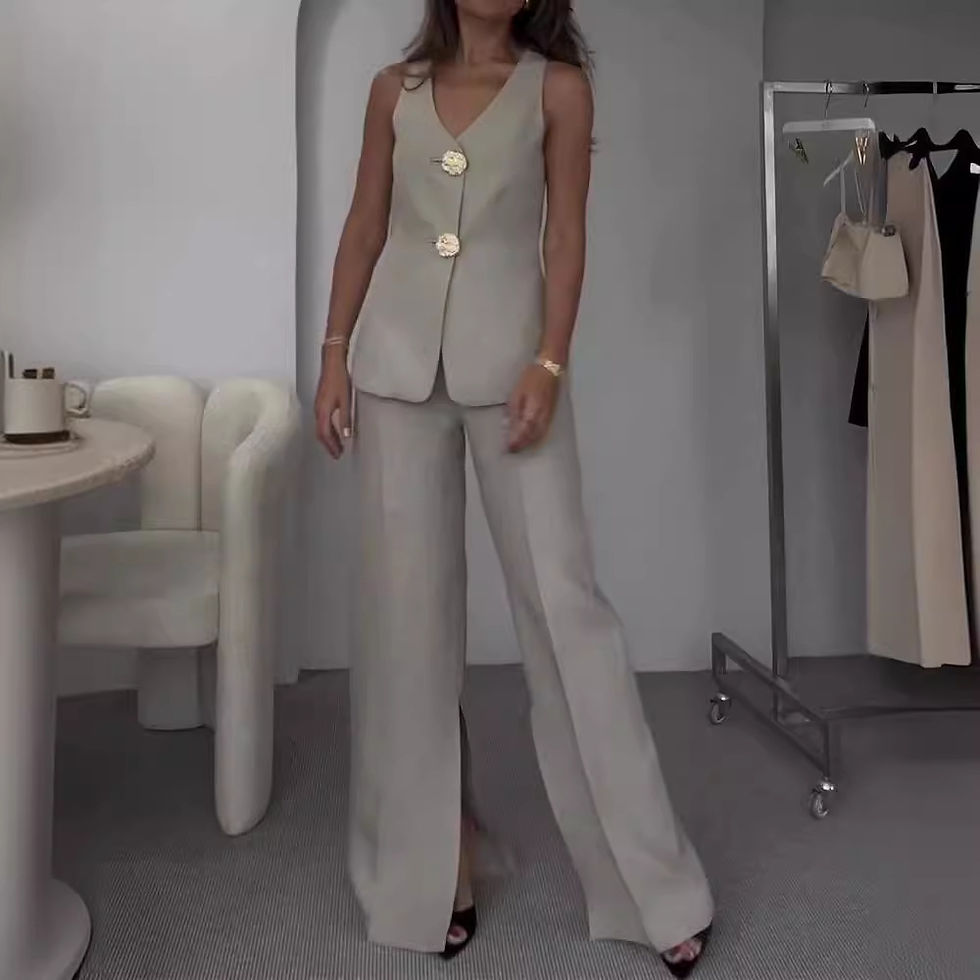Woman in beige vest and wide-leg pants with gold buttons