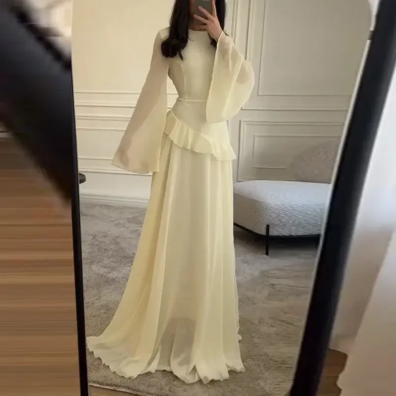 Thumbnail: Elegant cream long dress with flowing sleeves and ruffled waist