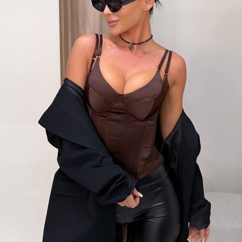 Thumbnail: Woman in brown bustier, black pants, and sunglasses