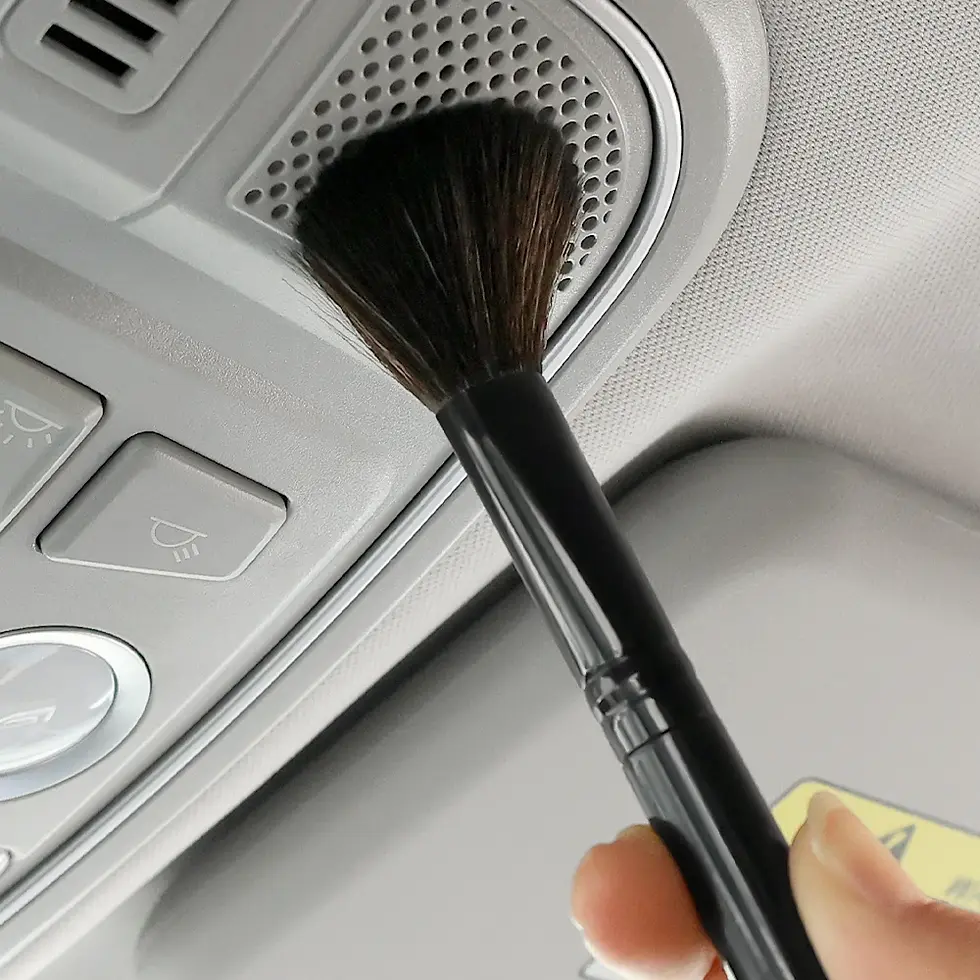 Thumbnail: Hand using brush to clean car vent