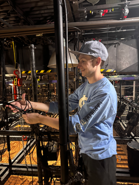 Grant cabling the Cat6 cables to send proper connection across projectors and the media server.