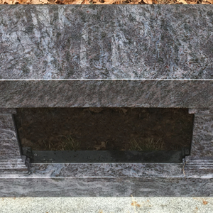 Polished dark gray granite bench memorial with a paneled pedestal base, ready for personalized engraving.