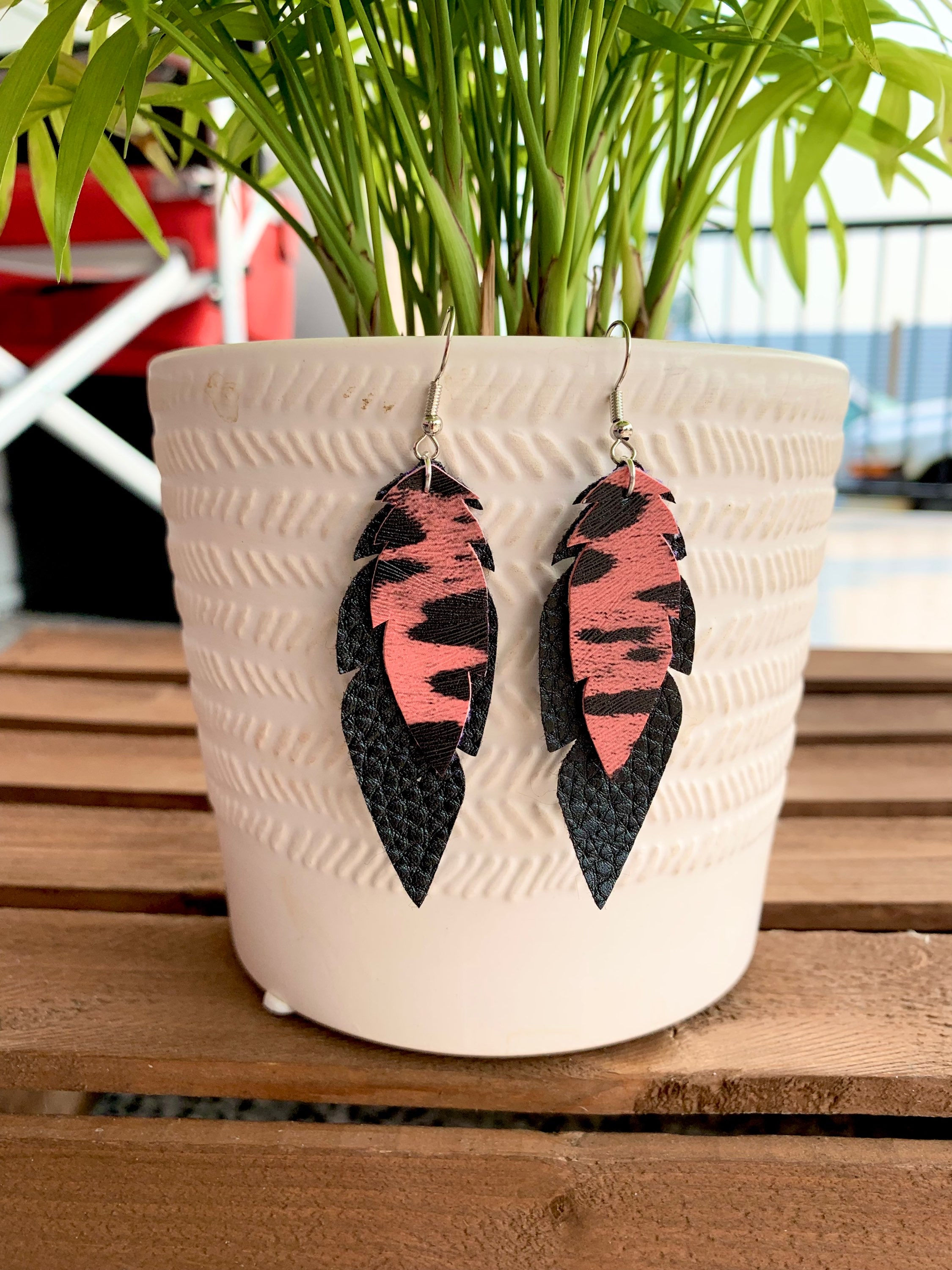 Small faux leather feather earrings 