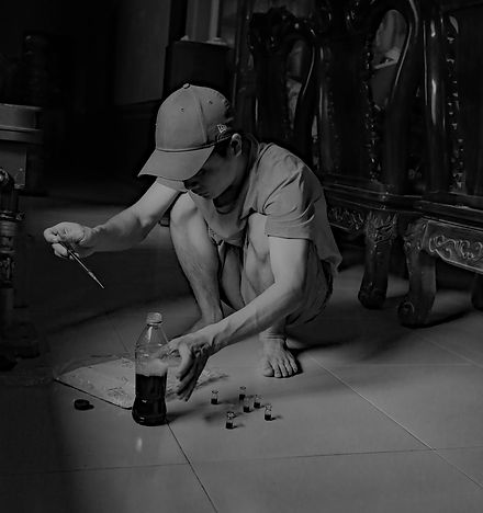 Bear bile worker syringing bile into a container to create bear bile products