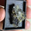 Thumbnail: 275,000 cpm Uraninite with UV Secondaries in Display Box