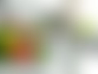 Glass of alkaline water with vegetables nearby