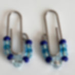 Glass beads threaded onto paper clips