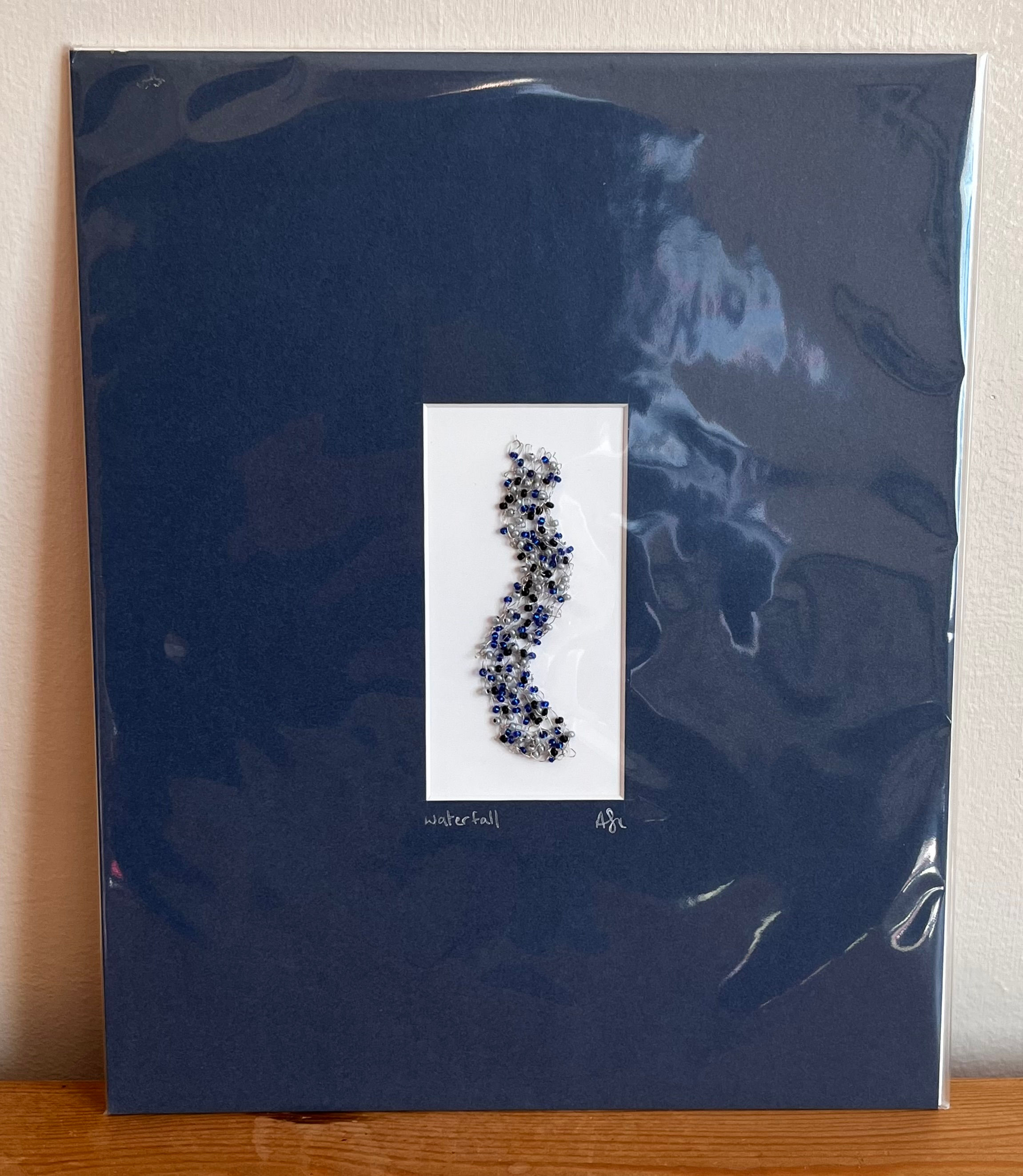 Mounted knitted wire and glass beads waterfall wall art