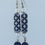 Thumbnail: white cross on navy paper and pearl earrings