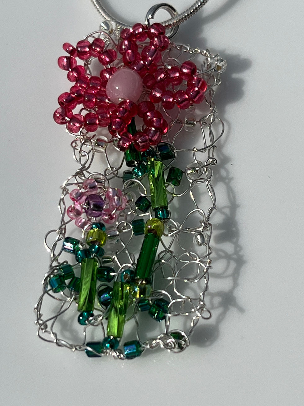 Thumbnail: Knitted pink flower pendant