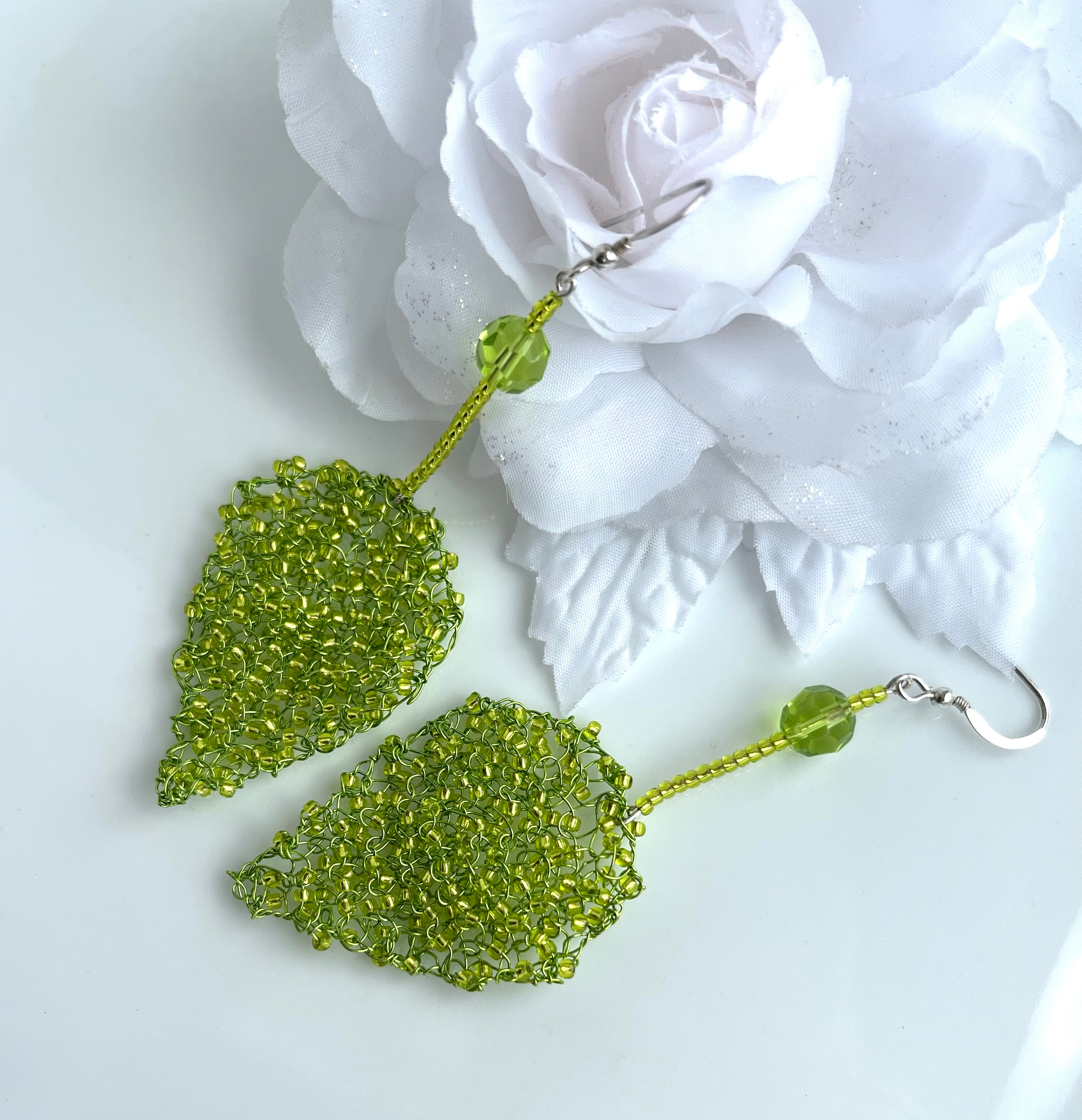 Long hand knitted wire and glass bead Green Leaf Earrings by Angela Smith