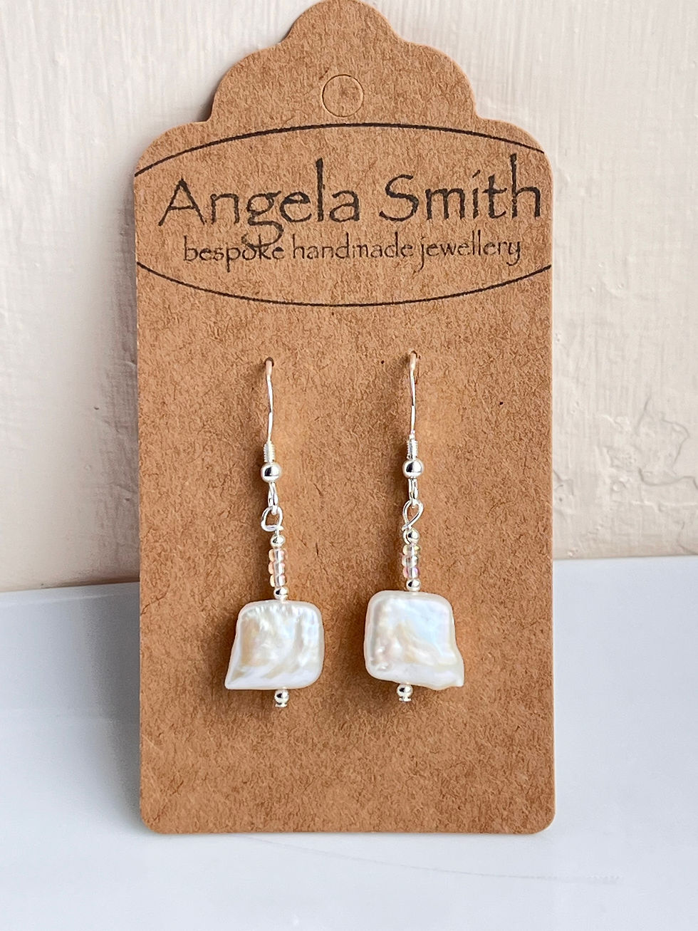 Thumbnail: Freshwater pearl earrings with silver and glass beads on display card