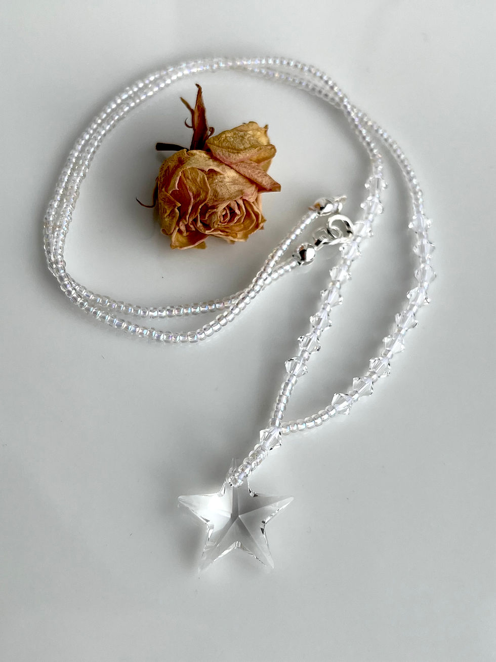 Thumbnail: Crystal glass star necklace on beaded chain